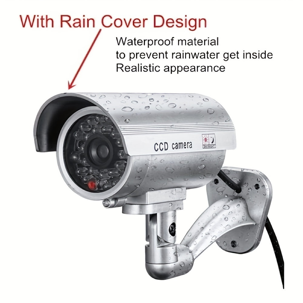 Caméra de surveillance factice – Système de vidéosurveillance simulée, lumières LED réalistes, support réglable et autocollants d'avertissement, caméra leurre de sécurité pour intérieur et extérieur – Lot de 2 ou 4