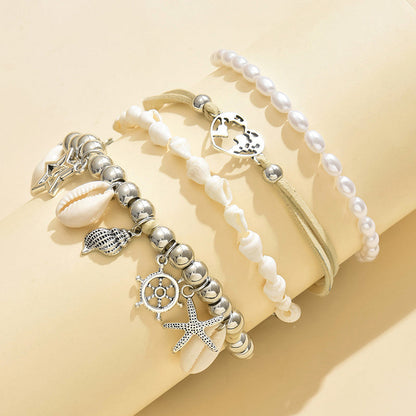 Lot de 4 bracelets de cheville océan – Bracelets de cheville pour femmes avec pendentifs perle, coquillage et étoile de mer plaqués argent 925, bijoux bohème pour vacances à la plage et soirées, ensemble de bracelets de cheville superposés en cadeau