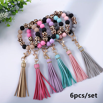 Lot de 6 porte-clés en perles de bois à motif léopard avec pompon et perles en silicone – Porte-clés de poignet idéal pour offrir à maman, à des amis ou pour les fêtes