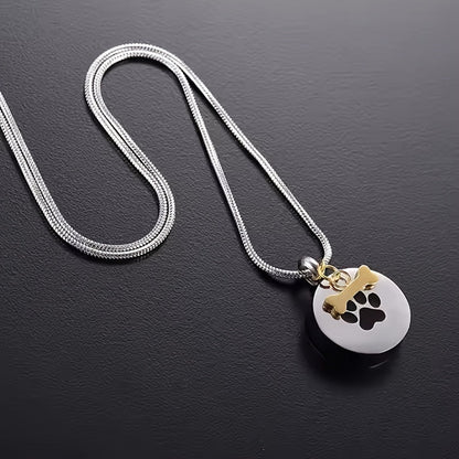Collier urne avec empreinte de patte pour cendres d'animaux - Pendentif médaillon souvenir rond en acier inoxydable pour le mémorial de chien et chat, bijoux de crémation porte-cendres pour le deuil d'un animal (argenté)
