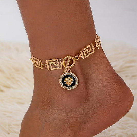 Chevillère dorée bohème avec pendentif tête de lion pour femme – Bracelet de cheville en acier inoxydable noir, bijou de pied bohème pour l'été et la plage avec pochette cadeau, accessoire de mode décontracté pour le quotidien et les vacances