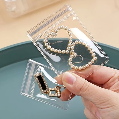 Sachets à bijoux refermables transparents, 100 pièces, pochettes zippées antioxydantes, sacs de rangement auto-adhésifs 7x10 cm pour organisation de bijoux, durables, réutilisables et protecteurs