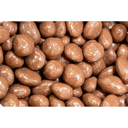 Raisins enrobés de chocolat au lait en vrac – Enrobage crémeux et sucré avec des raisins juteux et moelleux, une gourmandise saine pour offrir, grignoter ou pour les fêtes