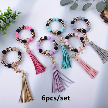 Lot de 6 porte-clés en perles de bois à motif léopard avec pompon et perles en silicone – Porte-clés de poignet idéal pour offrir à maman, à des amis ou pour les fêtes
