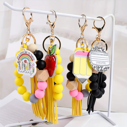 Ensemble cadeau de 4 porte-clés à perles pour enseignant – Porte-clés artisanaux avec breloques crayon, pomme, carnet et mot « TEACH », fermoir mousqueton, cadeau pour la fête des enseignants, remise de diplôme ou rentrée scolaire, pendentif pour sac